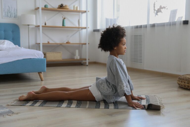 A girl doing Bhujangasana/ Cobra Pose